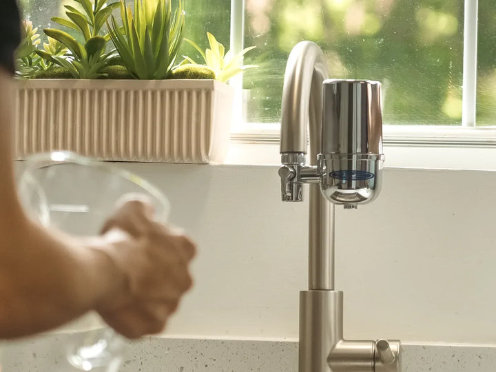 Crystal Quest faucet mount water filter on a kitchen faucet