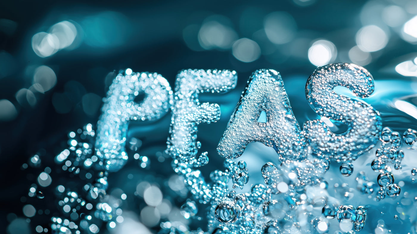The letters PFAS formed from water droplets, illustrating PFAS health effects in drinking water