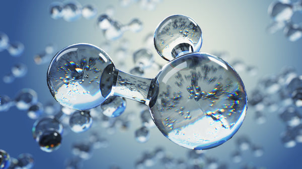 3D illustration of a translucent molecule among water droplets on a blue background, representing the molecular hydrogen in antioxidant water