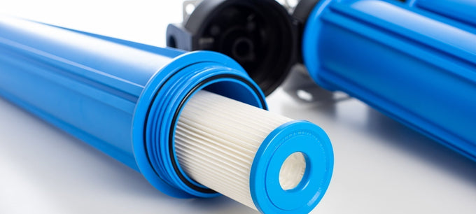 sediment water filter cartridge in blue cartridge housing