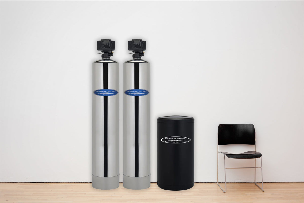 Crystal Quest whole house water filter system installed in a home utility room