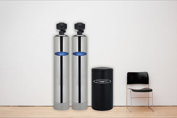 Crystal Quest whole house water filter system installed in a home utility room
