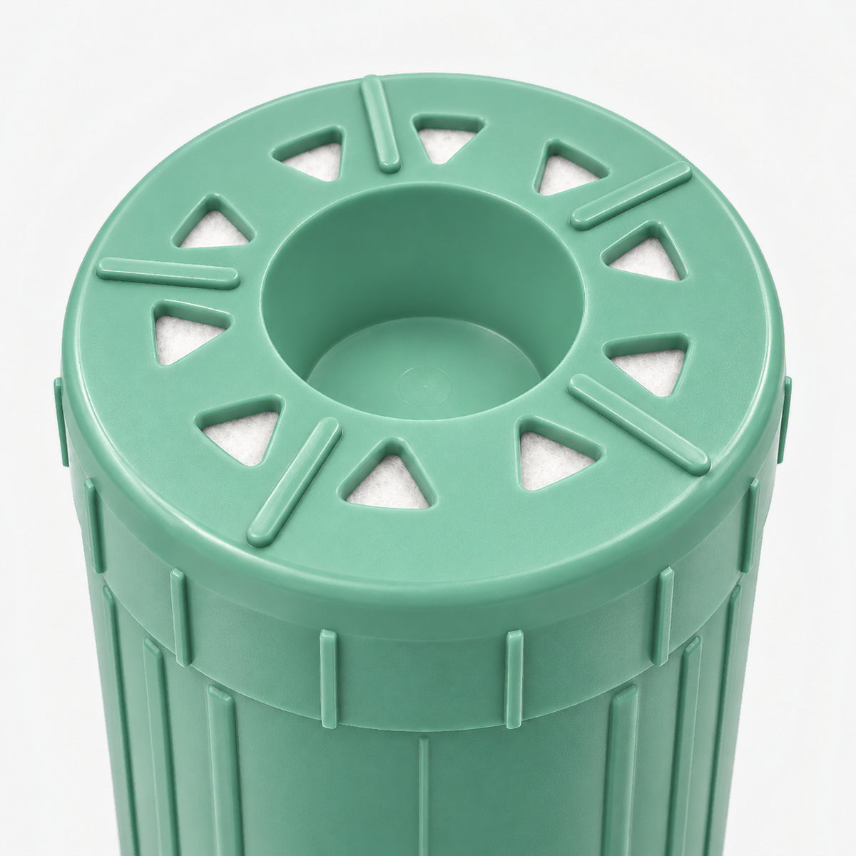 Alkalize/Ionizer, Mineralizer & Oxidation Cartridge, 2-7/8 inch size: close-up of the bottom end, triangular openings with white pads around the center well