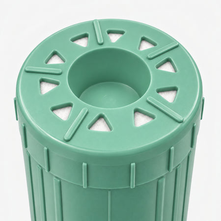 Alkalize/Ionizer, Mineralizer & Oxidation Cartridge, 2-7/8 inch size: close-up of the bottom end, triangular openings with white pads around the center well