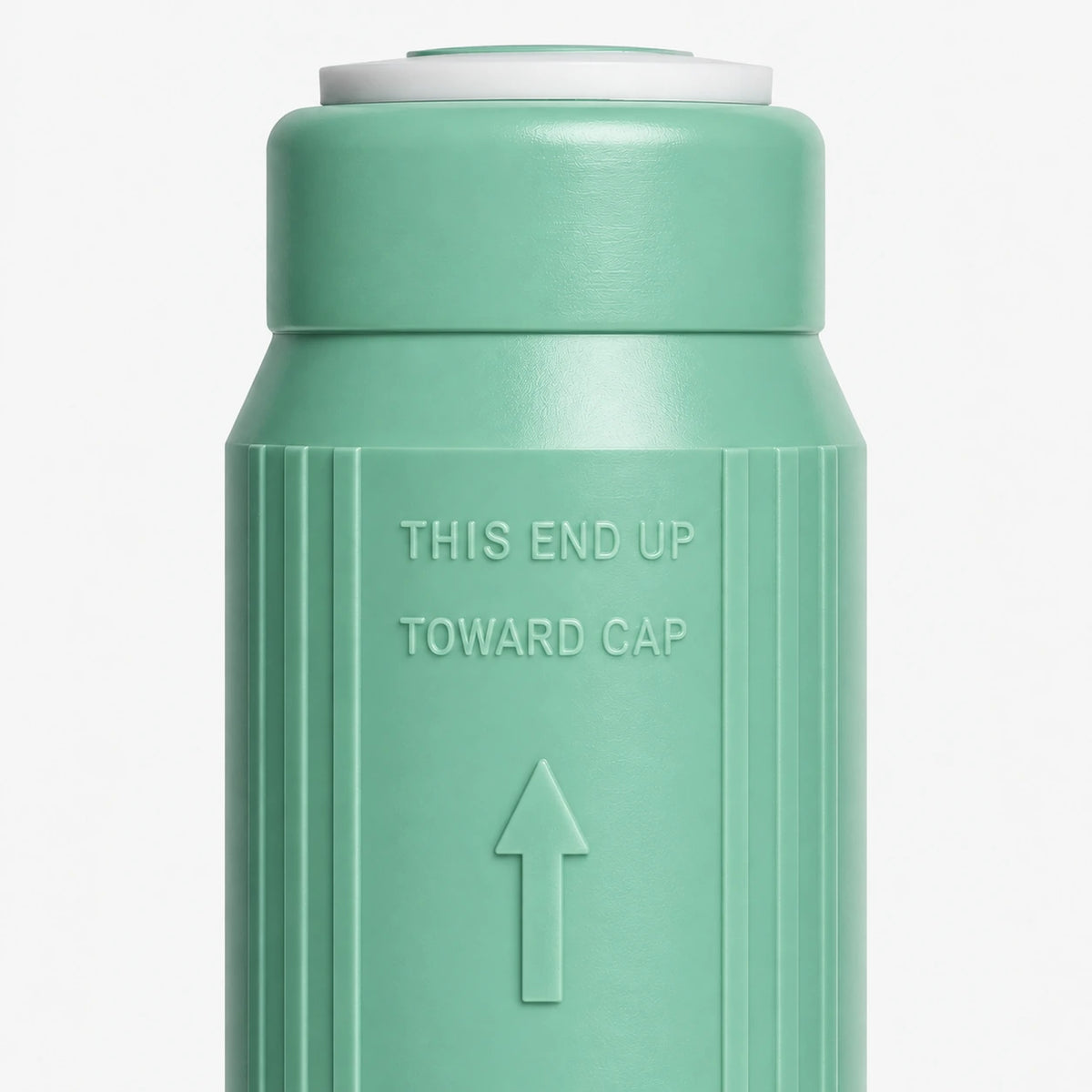 Alkalize/Ionizer, Mineralizer & Oxidation Cartridge, 2-7/8 inch size: close-up of the molded THIS END UP TOWARD CAP marking and arrow