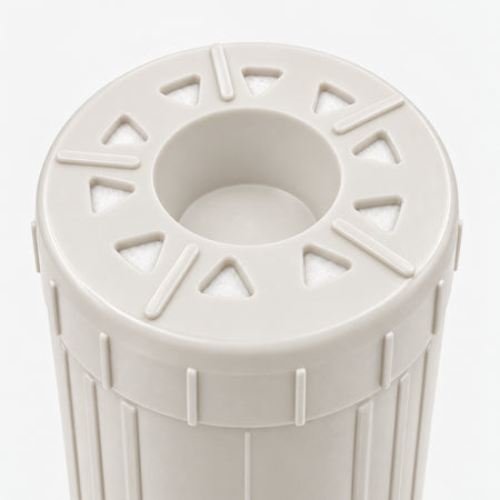 Arsenic Removal Filter Cartridge, 2-7/8 inch size: close-up of the bottom end, triangular openings with white pads around the center well