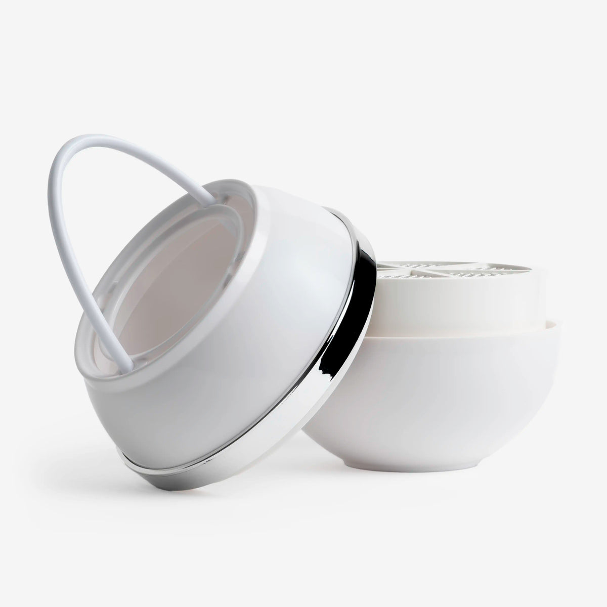 White Bath Ball Filter opened into two halves, showing the handle and the mesh filter insert