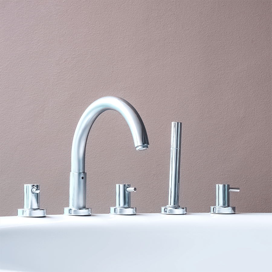 Chrome bathtub faucet set with spout, handheld sprayer and handles on a tub deck, where the Bath Ball Hook mounts