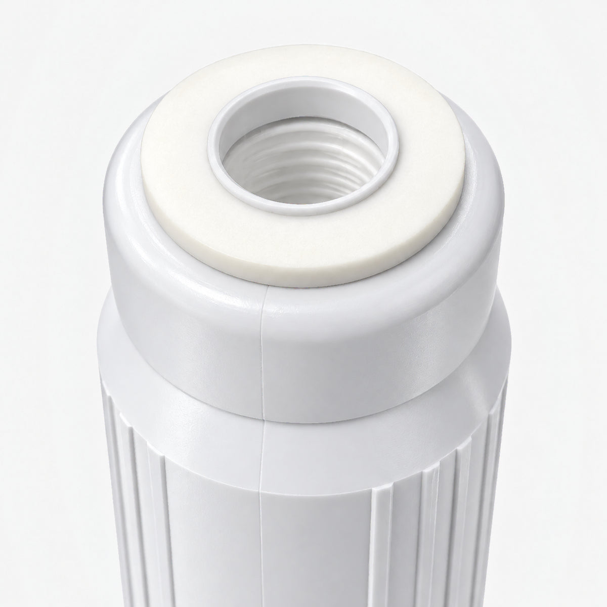 Calcium GAC Fluoride Reduction Filter Cartridge, 2-7/8 inch size: close-up of the top cap and white gasket around the threaded center port