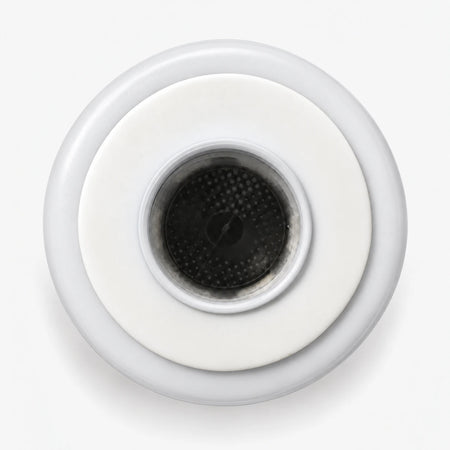 Calcium GAC Fluoride Reduction Filter Cartridge, 2-7/8 inch size: top end seen straight on, white seal ring around the center port