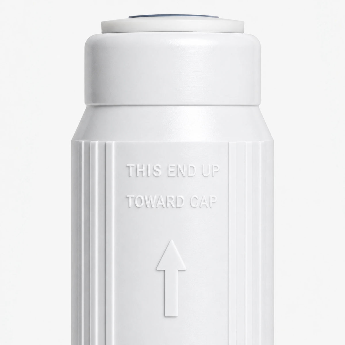 Calcium GAC Fluoride Reduction Filter Cartridge, 2-7/8 inch size: close-up of the molded THIS END UP TOWARD CAP marking and arrow