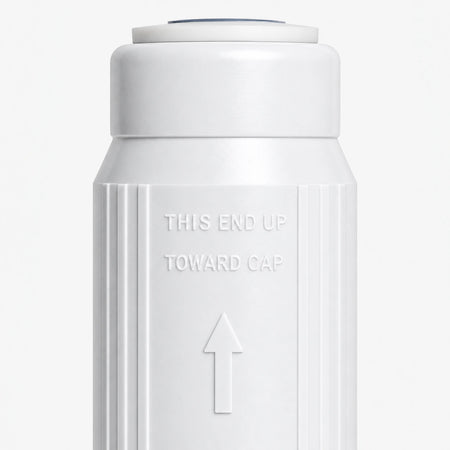 Calcium GAC Fluoride Reduction Filter Cartridge, 2-7/8 inch size: close-up of the molded THIS END UP TOWARD CAP marking and arrow