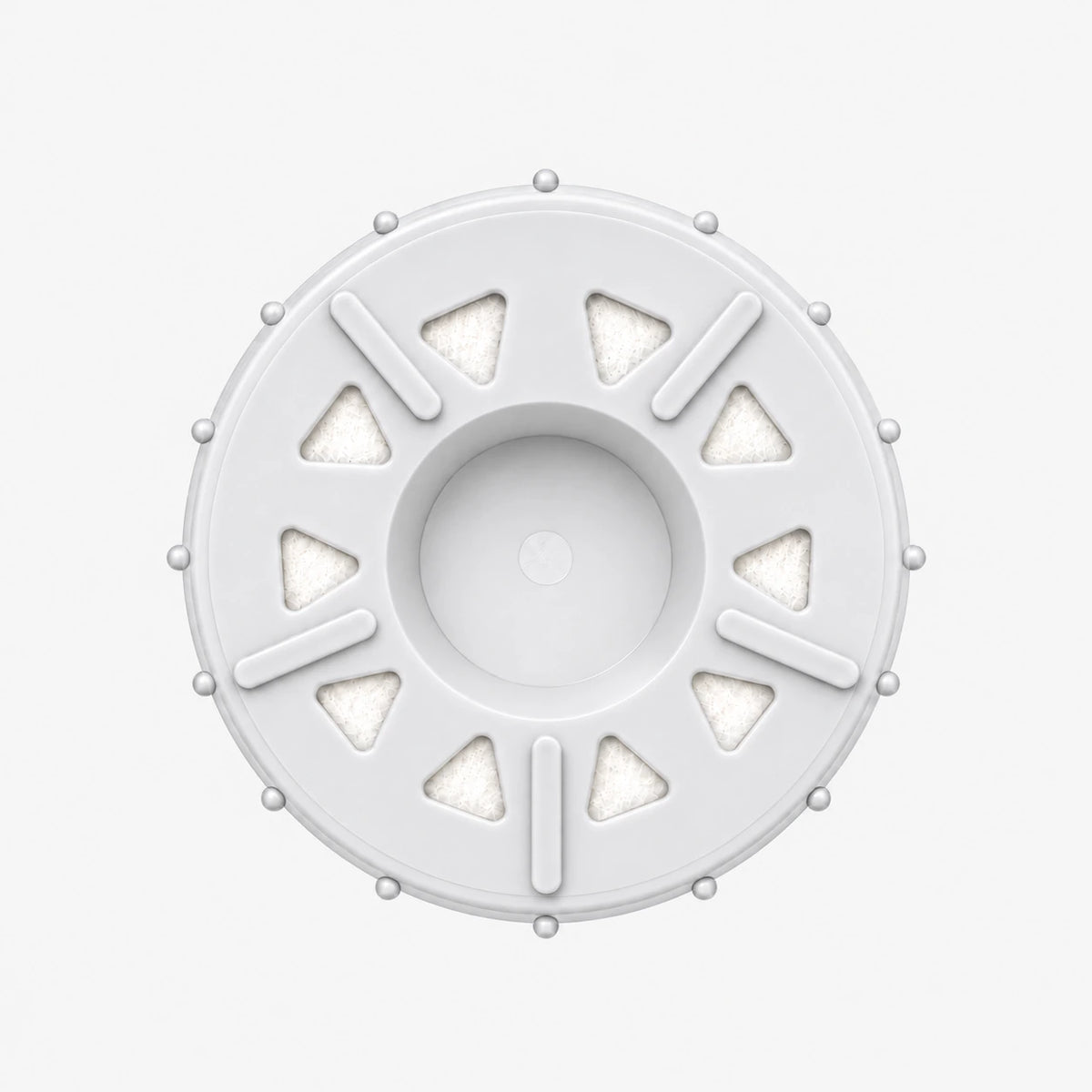 Calcium GAC Fluoride Reduction Filter Cartridge, 2-7/8 inch size: bottom end seen straight on, ten triangular openings with white pads around the center