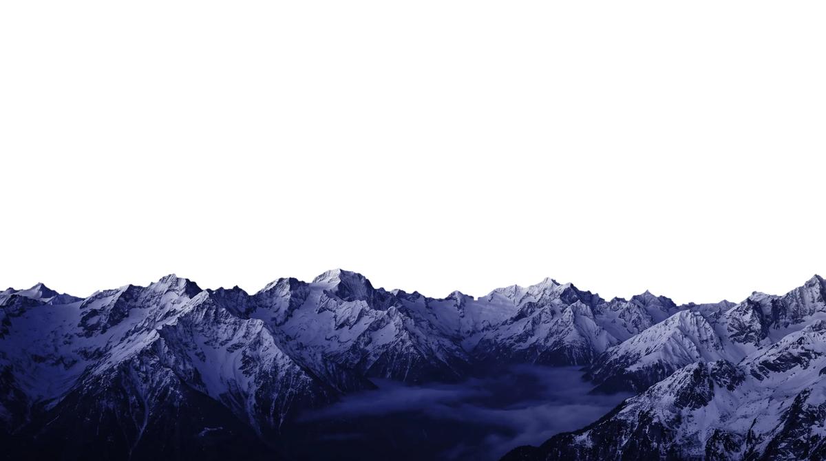 Snowy blue mountain range at dusk