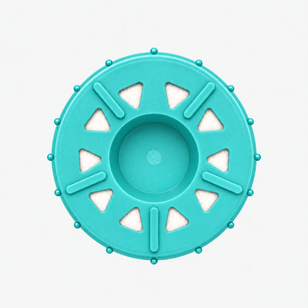 GAC Filter Cartridge (Coconut Shell Granular Activated Carbon), 2-7/8 inch size: bottom end seen straight on, ten triangular openings with white pads around the center
