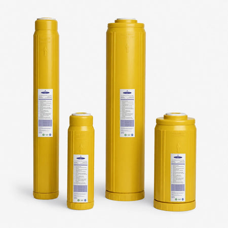 Iron Filter Cartridge, four yellow cartridges in two diameters and two heights, side by side