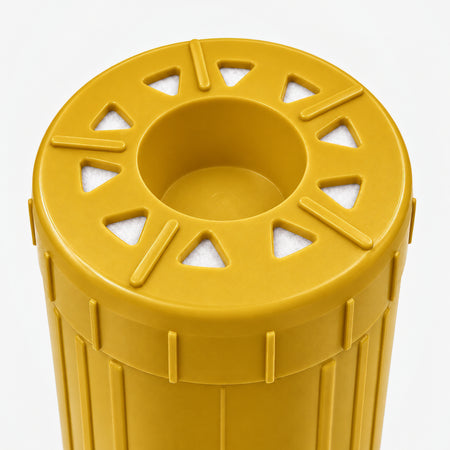 Iron Filter Cartridge, 2-7/8 inch size: close-up of the bottom end, triangular openings with white pads around the center well