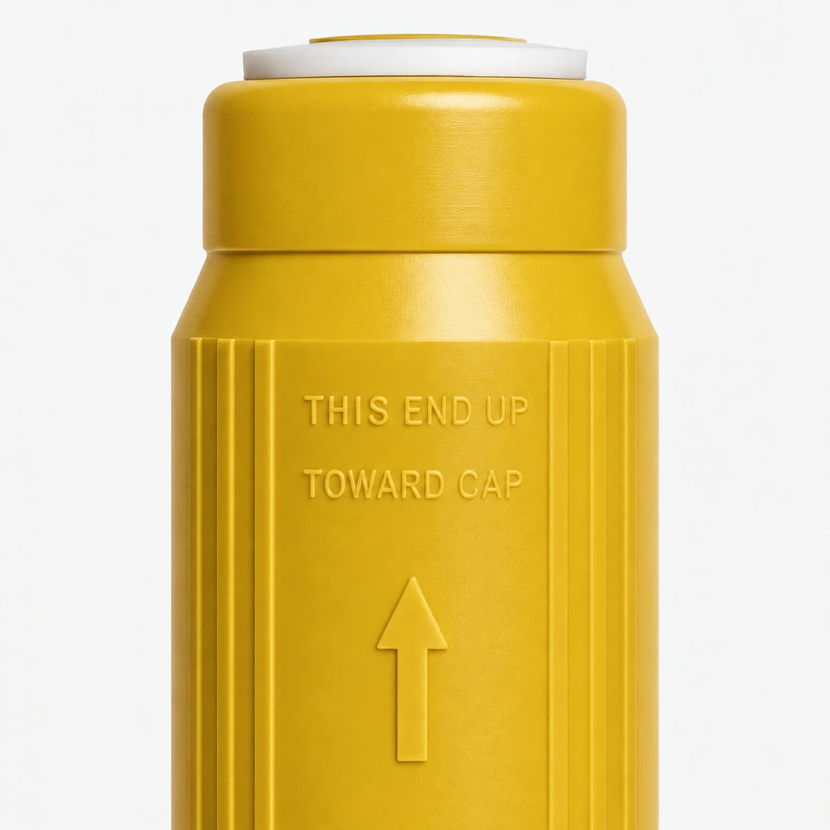 Iron Filter Cartridge, 2-7/8 inch size: close-up of the molded THIS END UP TOWARD CAP marking and arrow