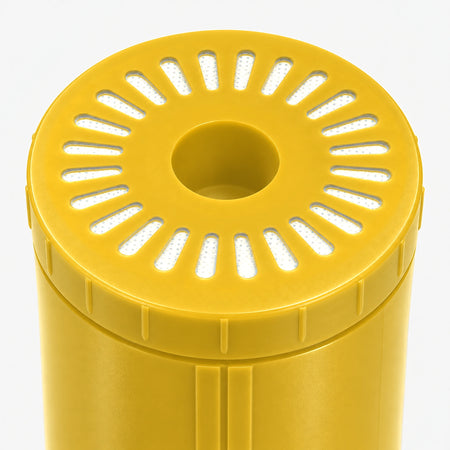 Iron Filter Cartridge, close-up of the wide yellow bottom end cap with radial slot openings
