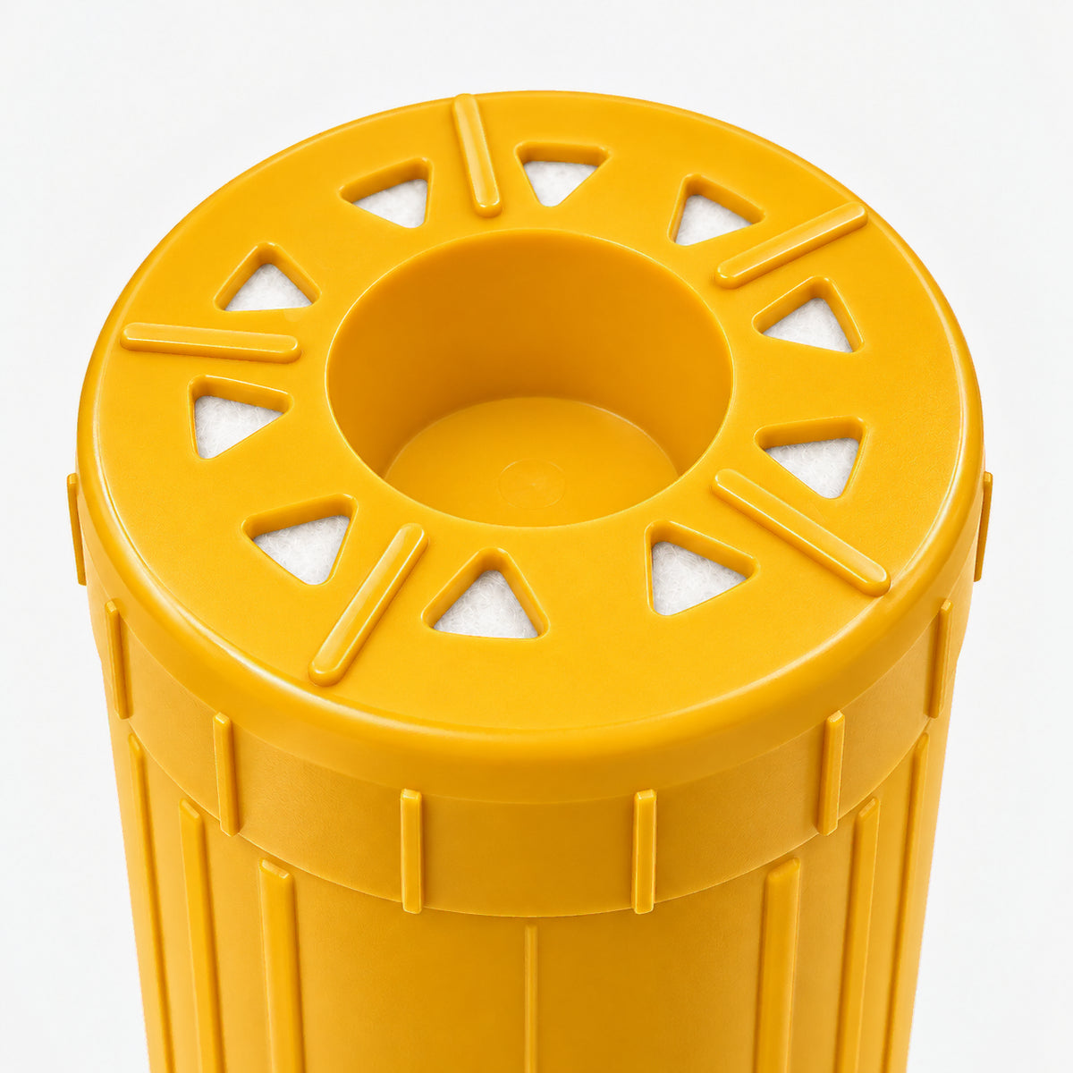 Lead Filter Cartridge, 2-7/8 inch size: close-up of the bottom end, triangular openings with white pads around the center well