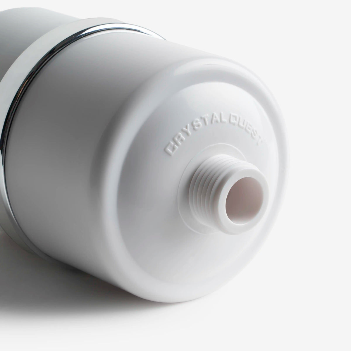 Shower Filter, close-up of the threaded outlet and embossed Crystal Quest logo on the housing