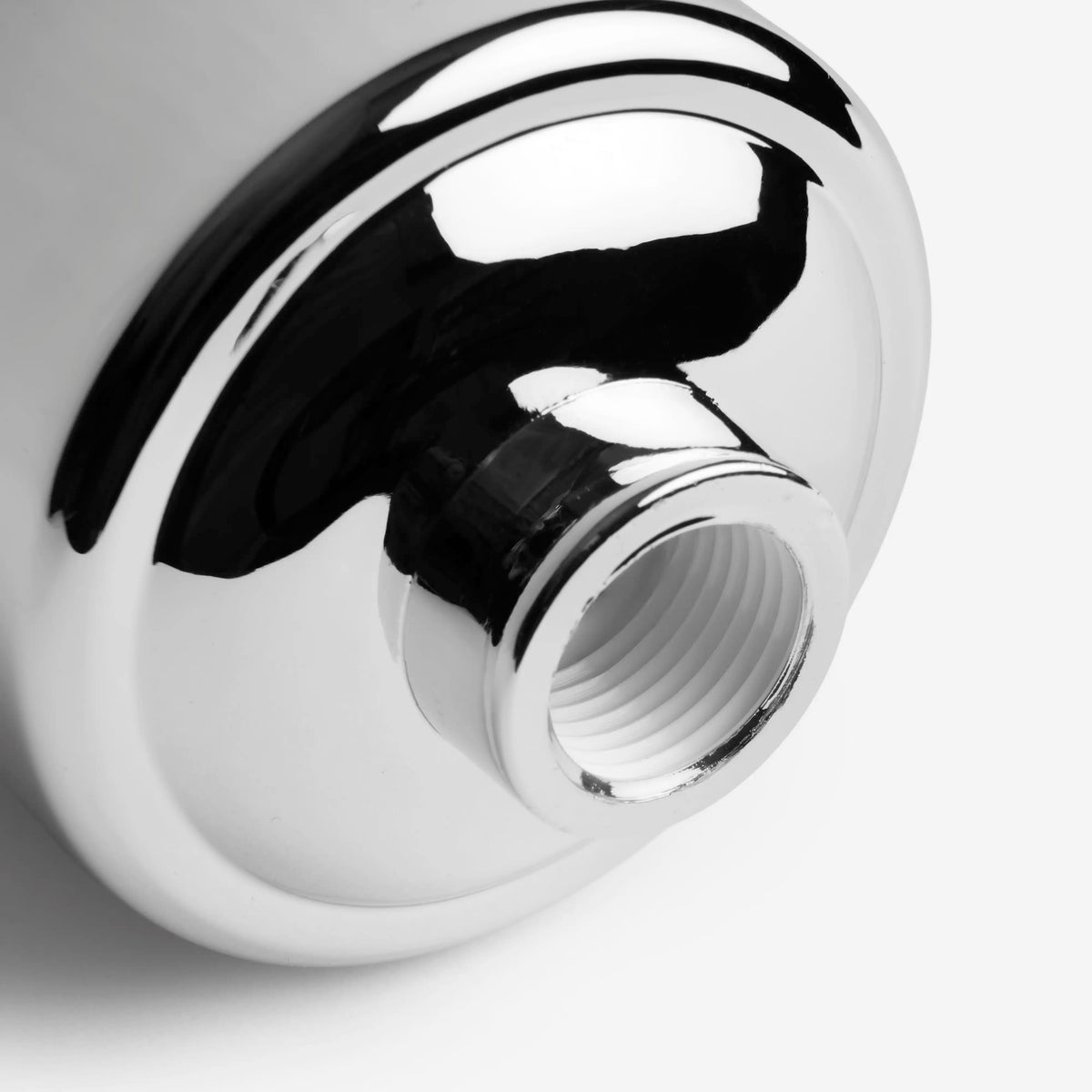Shower Filter in chrome, close-up of the threaded outlet on the bottom of the housing