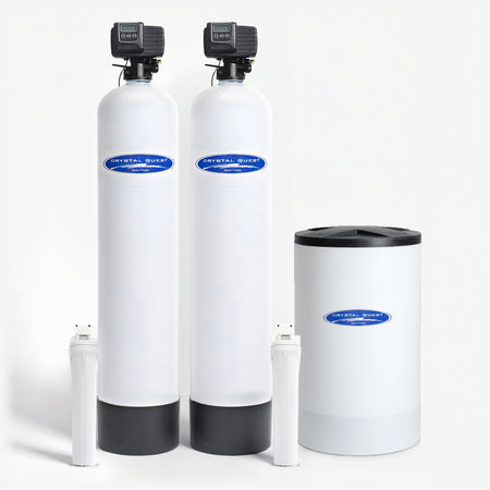 Nitrate Whole House Water Filter, two white fiberglass tanks with control valves, a white brine tank and two white filter housings