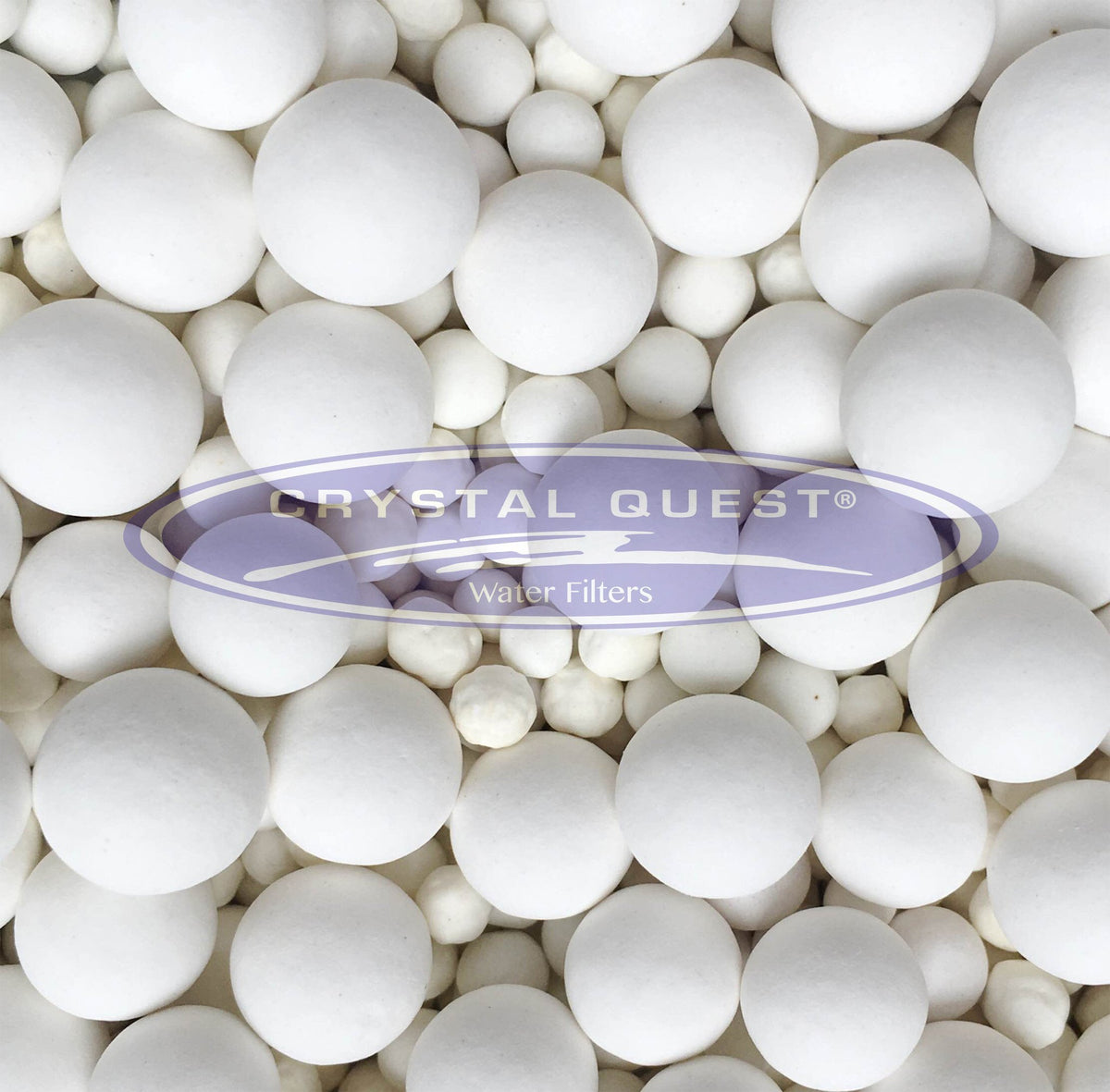 White Ceramic Balls, close-up of mixed size white ceramic spheres, Crystal Quest logo overlay