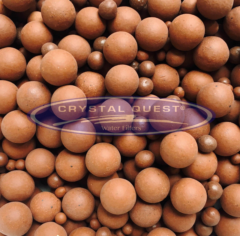 Tourmaline Balls, close-up of reddish brown ceramic spheres in mixed sizes, Crystal Quest logo overlay