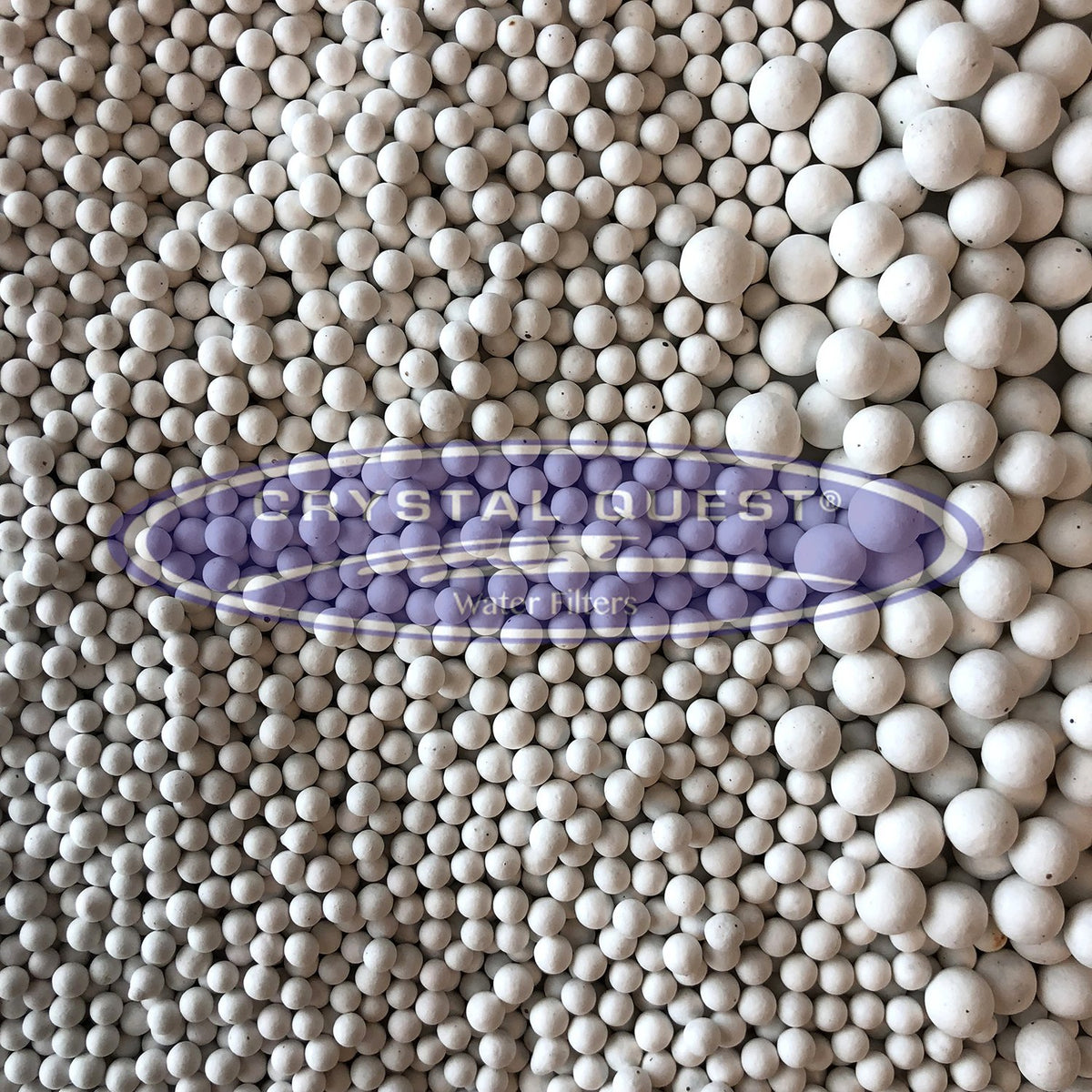 White Ceramic Balls, bulk spread of small and large white ceramic beads, Crystal Quest logo overlay