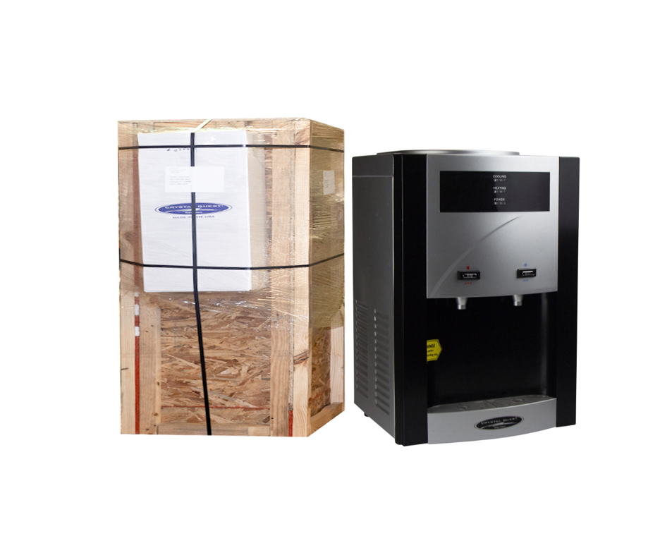 TURBO Countertop Bottleless Water Cooler beside its wooden shipping crate