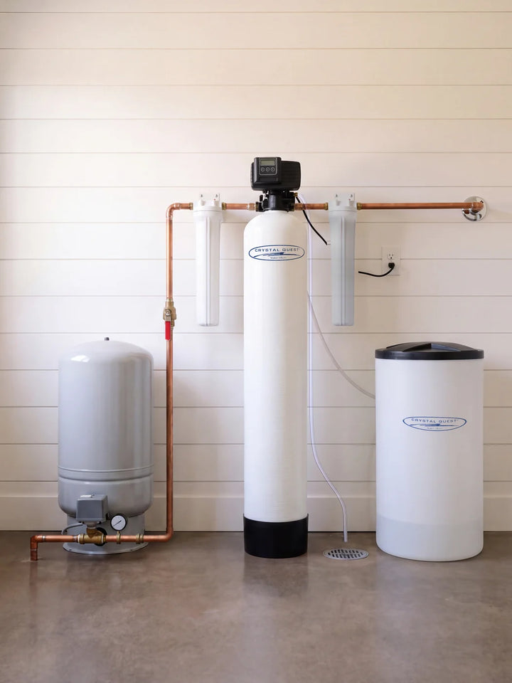 Illustrative view of a Whole House Water Softener and brine tank plumbed after a well pressure tank