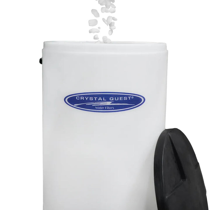 Salt pellets poured into a Crystal Quest brine tank